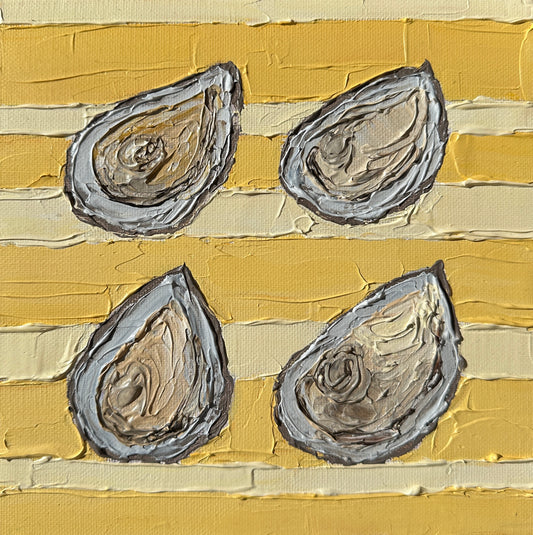 Four oyster shells on a textured yellow and beige background