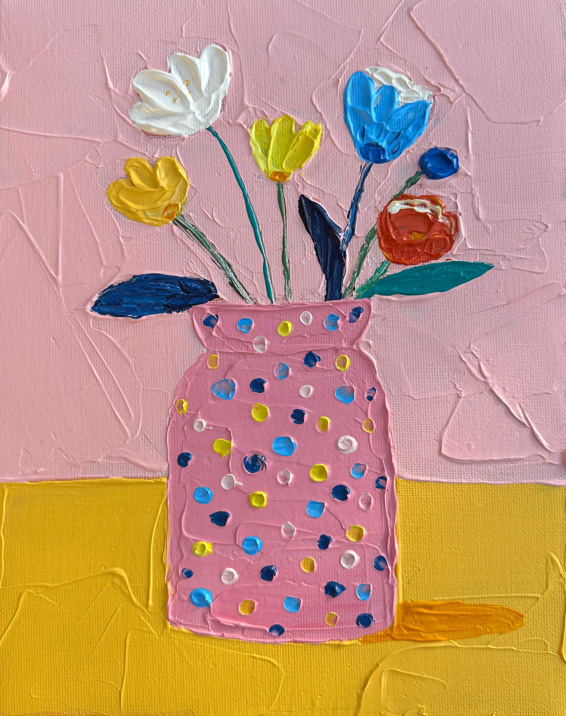 Painting of a polka dot vase with flowers on a pink and yellow background