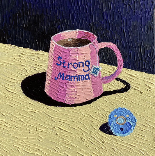 Pink textured mug with 'Strong Mamma' text on a textured surface with a dark background