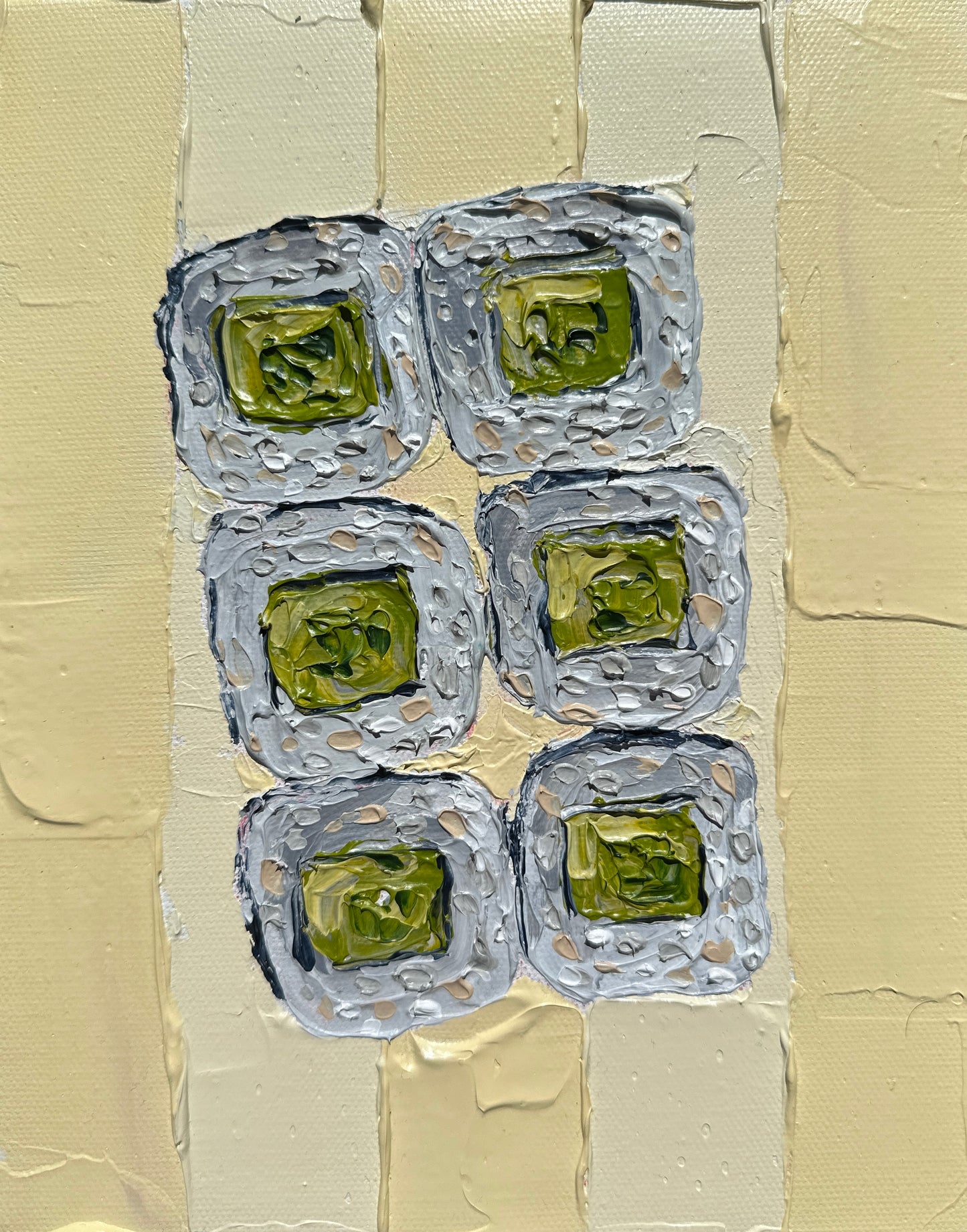 Artistic depiction of sushi rolls with wasabi on a textured beige background